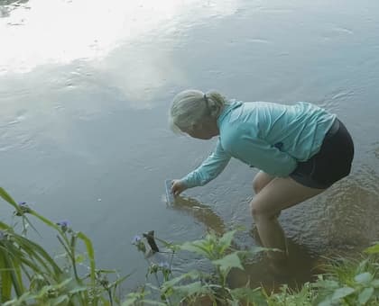 Ann conducting water quality testing